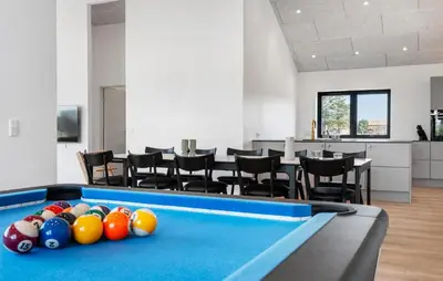 a pool table in a room with chairs at Stunning Home In Saltum With Sauna in Saltum