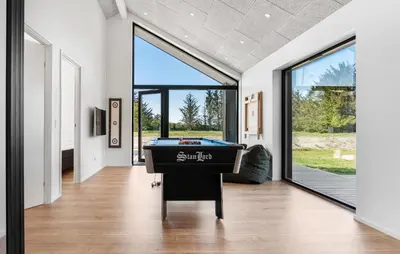 a house with a pool table in a hallway at Stunning Home In Saltum With Sauna in Saltum