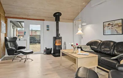 a living room with a couch and a fireplace at Gorgeous Home In Thisted in Thisted