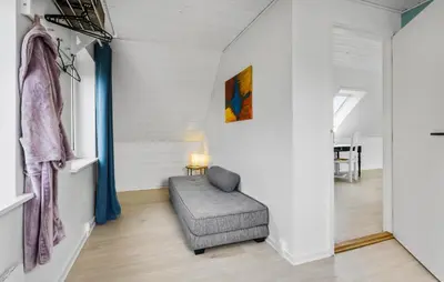 a room with a chair and a painting on the wall at 3 Bedroom Beautiful Home In Vesløs in Vesløs