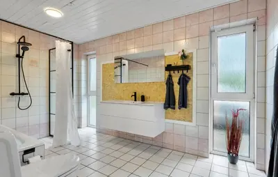 a bathroom with a sink and a mirror at 3 Bedroom Beautiful Home In Vesløs in Vesløs