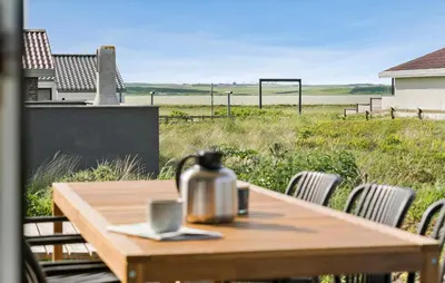 a wooden table with a tea kettle on top of it at Stunning Home In Harboøre With Wifi in Harboør