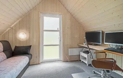 a bedroom with a bed and a desk with a computer at Beautiful Home In Spøttrup With Kitchen in Spottrup