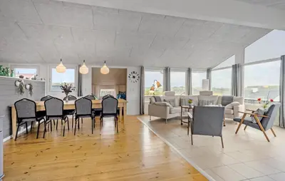 a dining room and living room with a table and chairs at Nice Home In Lemvig With Wifi in Lemvig