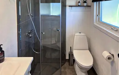 a bathroom with a toilet and a glass shower at Amazing Home In Højslev With Wifi in Højslev