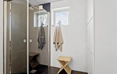 a bathroom with a walk in shower and a glass door at Stunning Home In Bedsted Thy With Wifi in Bedsted Thy