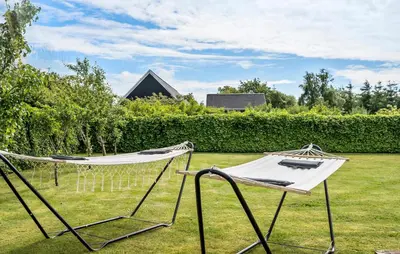a couple of hammocks in a yard at Awesome Home In Vemb With Kitchen in Vemb