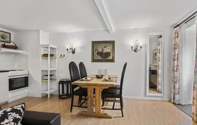 a kitchen and dining room with a table and chairs at Lejl 5 in Brovst