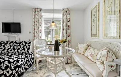 a living room with a couch and a table at Lejl 2 in Brovst