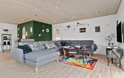 a living room with a couch and a table at Amazing Home In Aars With Wifi in Års