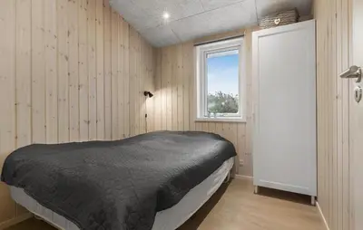 a bedroom with a bed and a window at Awesome Home In Løgstør With Wifi in Løgstør