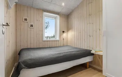 a bedroom with a bed and a window at Awesome Home In Løgstør With Wifi in Løgstør