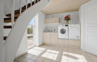 a laundry room with a washer and dryer at 3 Bedroom Beautiful Home In Roslev in Roslev