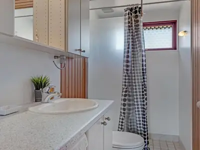 a bathroom with a sink and a toilet and a shower at Holiday Home Frandsine - 1-2km from the sea by Interhome in Thisted
