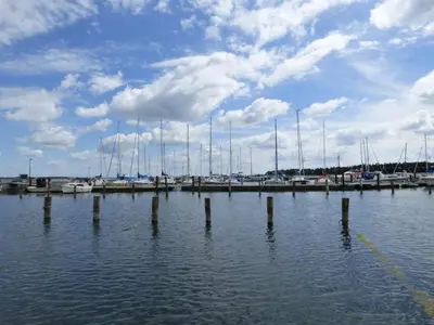 a group of boats docked at a dock in the water at 5 person holiday home in Roslev-By Traum in Roslev