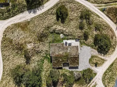 an aerial view of a house on a road at Holiday Home Annlisa - 1km from the sea by Interhome in Blokhus