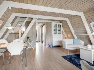a living room with white furniture and wooden ceilings at Holiday Home Erly - 18km to the fjord by Interhome in Farsø