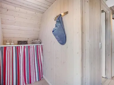 a guitar hanging on the wall of a room at Holiday Home Erly - 18km to the fjord by Interhome in Farsø