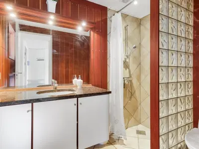 a bathroom with a sink and a shower at Holiday Home Lilie - 350m from the sea by Interhome in Saltum