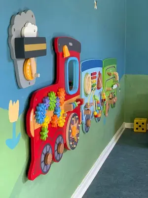 a toy train on the wall of a childs room at Hotel Traneparken in Nykøbing Mors