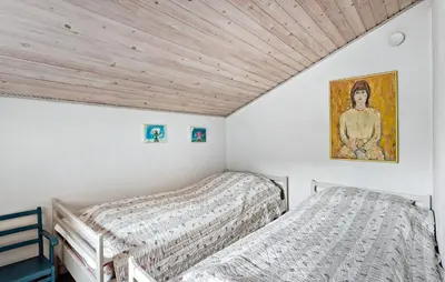 a bedroom with two beds and a painting on the wall at 3 Bedroom Gorgeous Home In Fur in Furland
