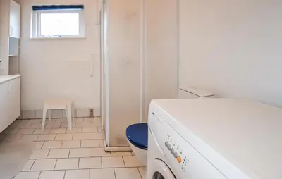 a washing machine in a bathroom with a window at 3 Bedroom Gorgeous Home In Fur in Furland