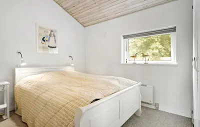 a white bedroom with a bed and a window at 3 Bedroom Gorgeous Home In Fur in Furland