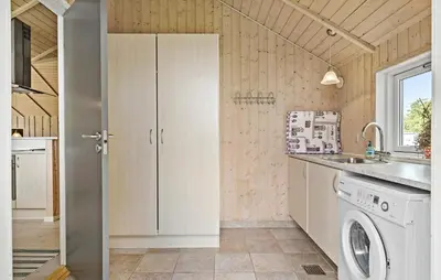 a kitchen with a washing machine and a sink at 3 Bedroom Cozy Home In Højslev in Højslev