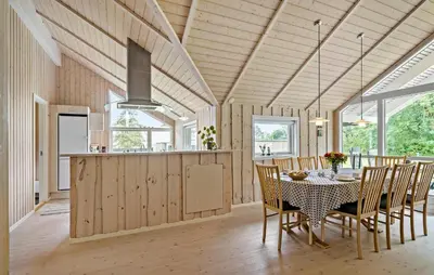 a kitchen and dining room with a table and chairs at 3 Bedroom Cozy Home In Højslev in Højslev