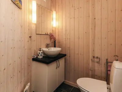 a bathroom with a sink and a toilet at 4 star holiday home in Øster Assels-By Traum in Øster Assels