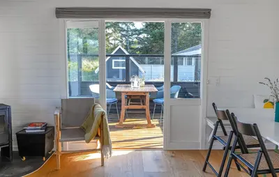 a living room with a table and a dining room at 2 Bedroom Lovely Home In Thisted in Thisted