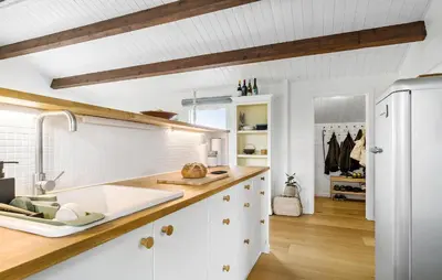 a kitchen with white cabinets and a white refrigerator at 2 Bedroom Lovely Home In Thisted in Thisted
