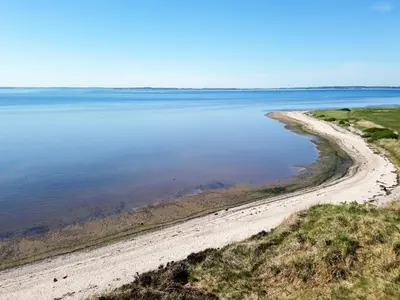 an empty beach in the middle of a body of water at 4 star holiday home in Gedsted-By Traum in Gedsted