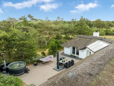 an aerial view of a cottage with a hot tub at Holiday Home Pihla - 1-1km from the sea by Interhome in Fjerritslev