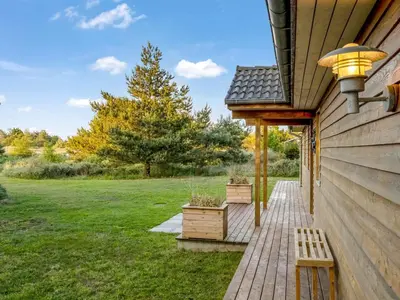 a wooden walkway leading to a house at Holiday Home Zölestine - from the sea by Interhome in Fjerritslev