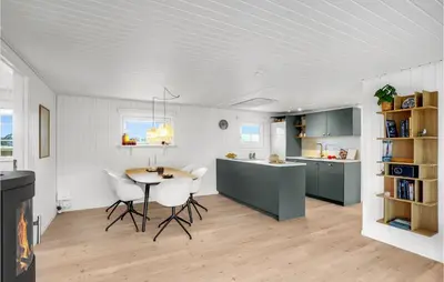 a kitchen and dining room with a table and chairs at 2 Bedroom Stunning Home In Harboøre in Harboør