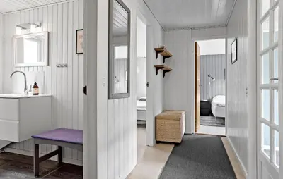 a white bathroom with a sink and a mirror at 4 Bedroom Lovely Home In Vestervig in Vestervig
