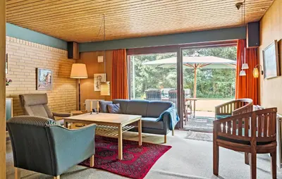 a living room with chairs and a table at Stunning Home In Højslev With Wifi in Højslev