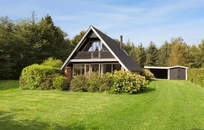 a house with a large yard with a green lawn at 3 Bedroom Stunning Home In Højslev in Højslev