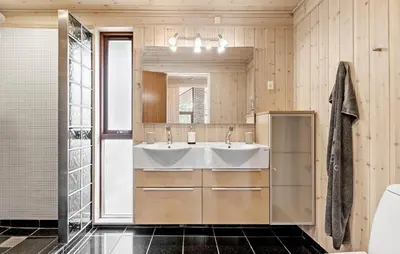 a bathroom with a sink and a mirror at 3 Bedroom Beautiful Home In Løgstør in Løgstør