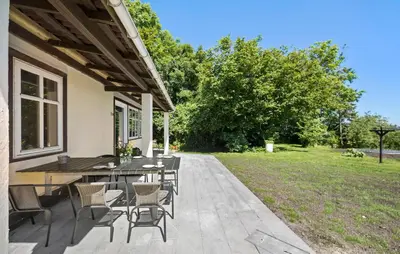 a patio with a table and chairs and a yard at Stunning Home In Ranum With Wifi in Ranum