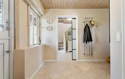 a hallway of a home with a door and a coat rack at Stunning Home In Ranum With Wifi in Ranum
