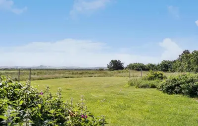 a field of grass with a fence in the distance at Nice Home In Harboøre With Wifi in Harboør