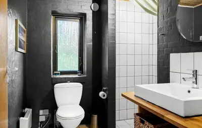 a bathroom with a white toilet and a sink at Nice Home In Harboøre With Wifi in Harboør