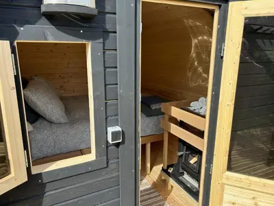 a inside view of a wooden house with a door at Stone MT Garden Pod in Snedsted