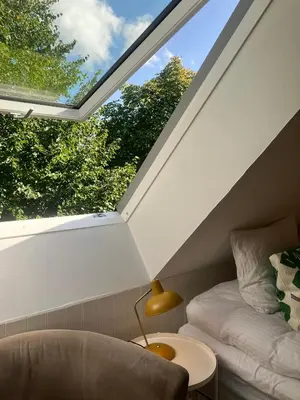 a skylight in a room with a couch and a table at Krogsgaarden B&B in Nibe