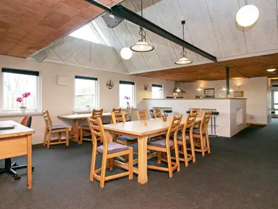 a large dining room with a table and chairs at 14 person holiday home in Løgstør-By Traum in Løgstør
