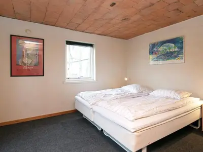 a bedroom with a large bed in a room at 14 person holiday home in Løgstør-By Traum in Løgstør