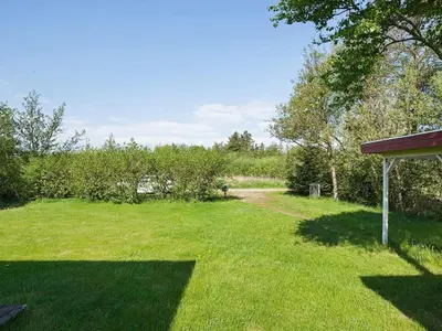 a yard with a field of grass and trees at 8 person holiday home in Hurup Thy-By Traum in Sindrup