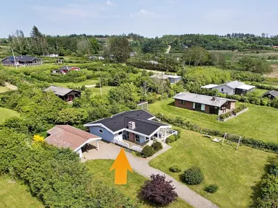 an aerial view of a house with an arrow pointing to its backyard at 6 person holiday home in Spøttrup-By Traum in Lihme